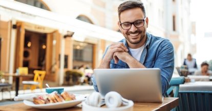 Man fills out a restaurant survey for customer feedback