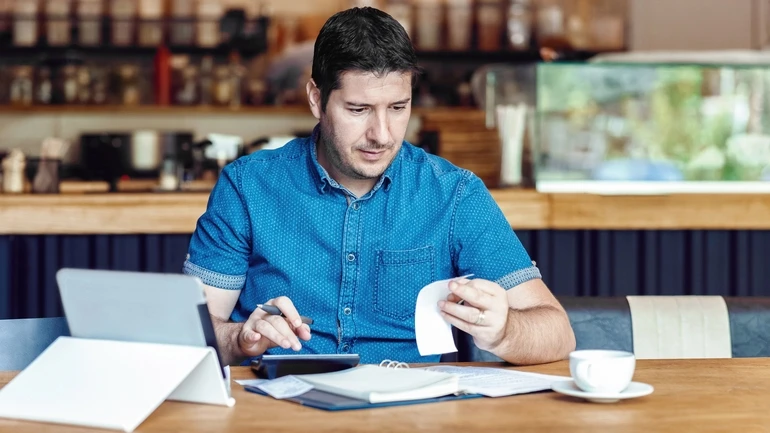 Restaurant manager does the books.
